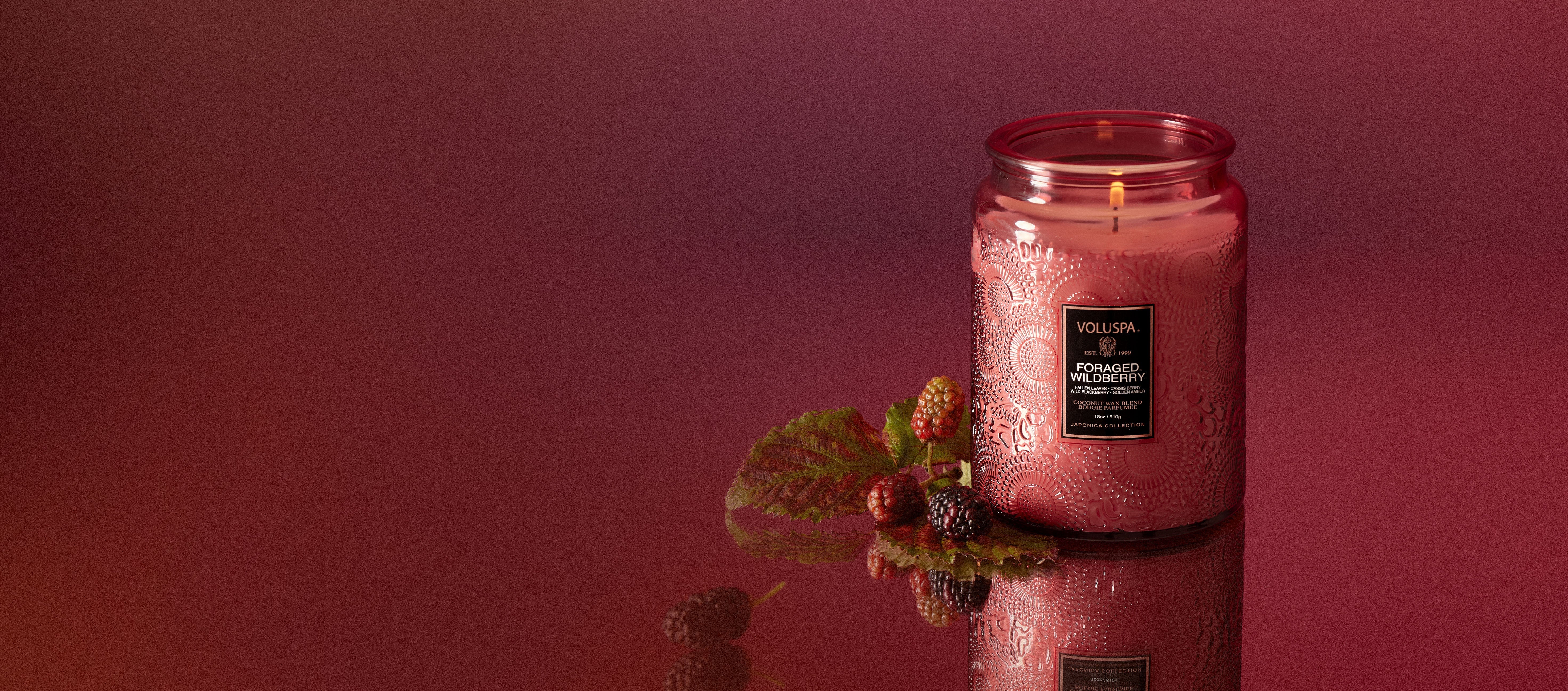 Fall Harvest candle on a deep red background